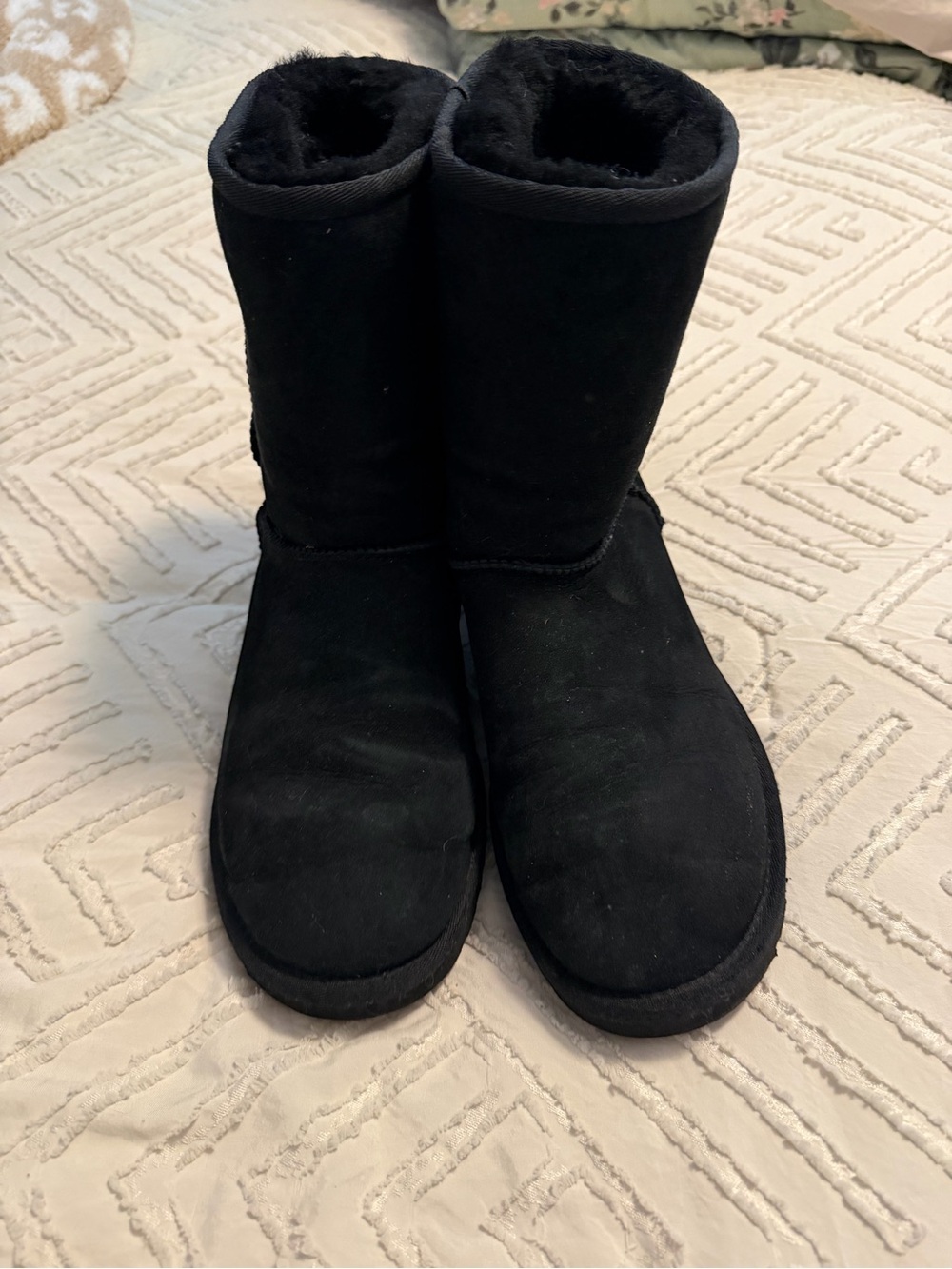 UGG Women's Black Short Shearling Boots has tear